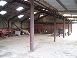 Photo of the inside of a barn building on a working farm