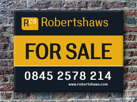 Photo of Robertshaws Chartered Surveyors 'Sale' Board on wall.